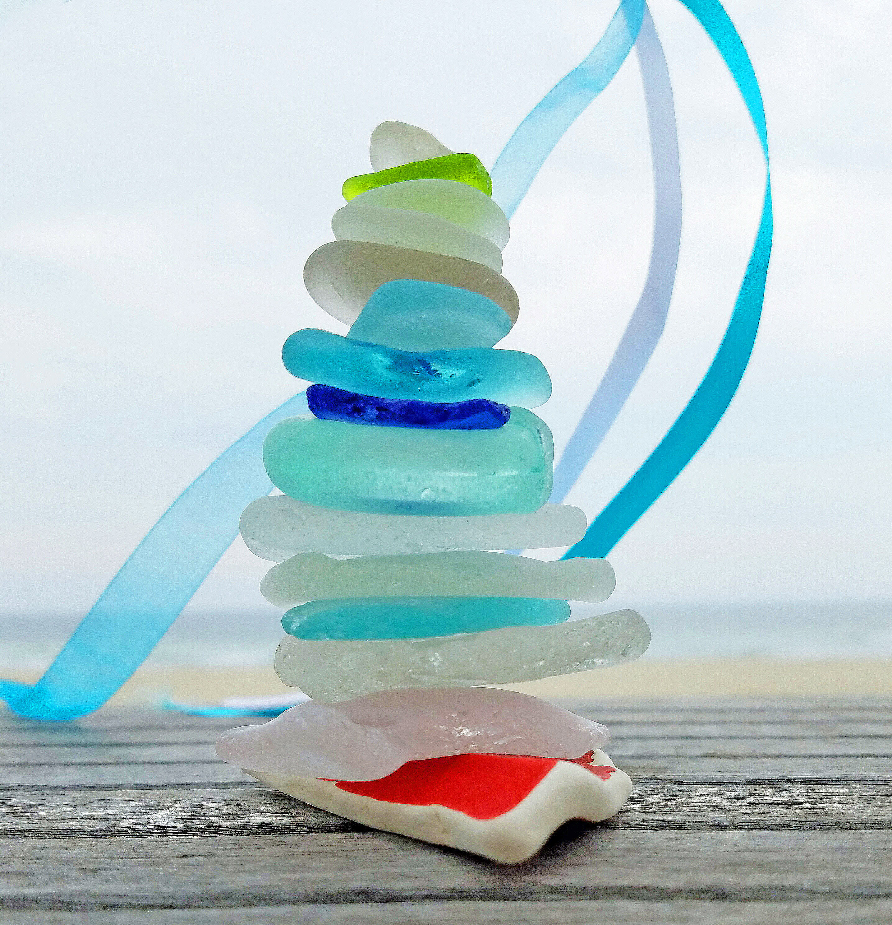 Stacked sea glass cairn